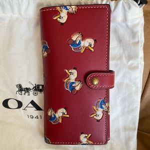 Coach 1941 Ducks print leather tri fold wallet, in red. Brand new.